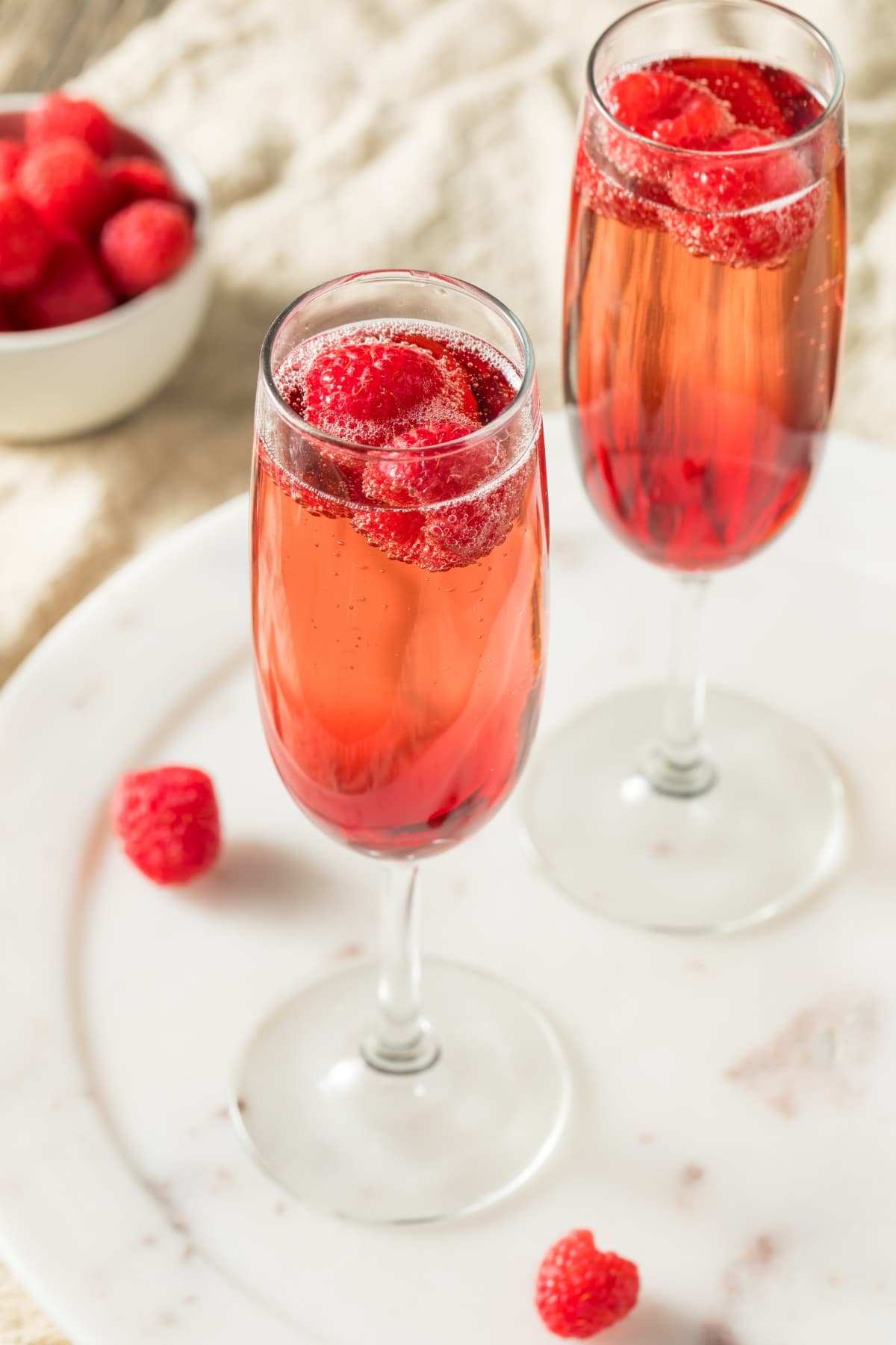 Refreshing Alcoholic Kir Royale with Champange and Raspberries