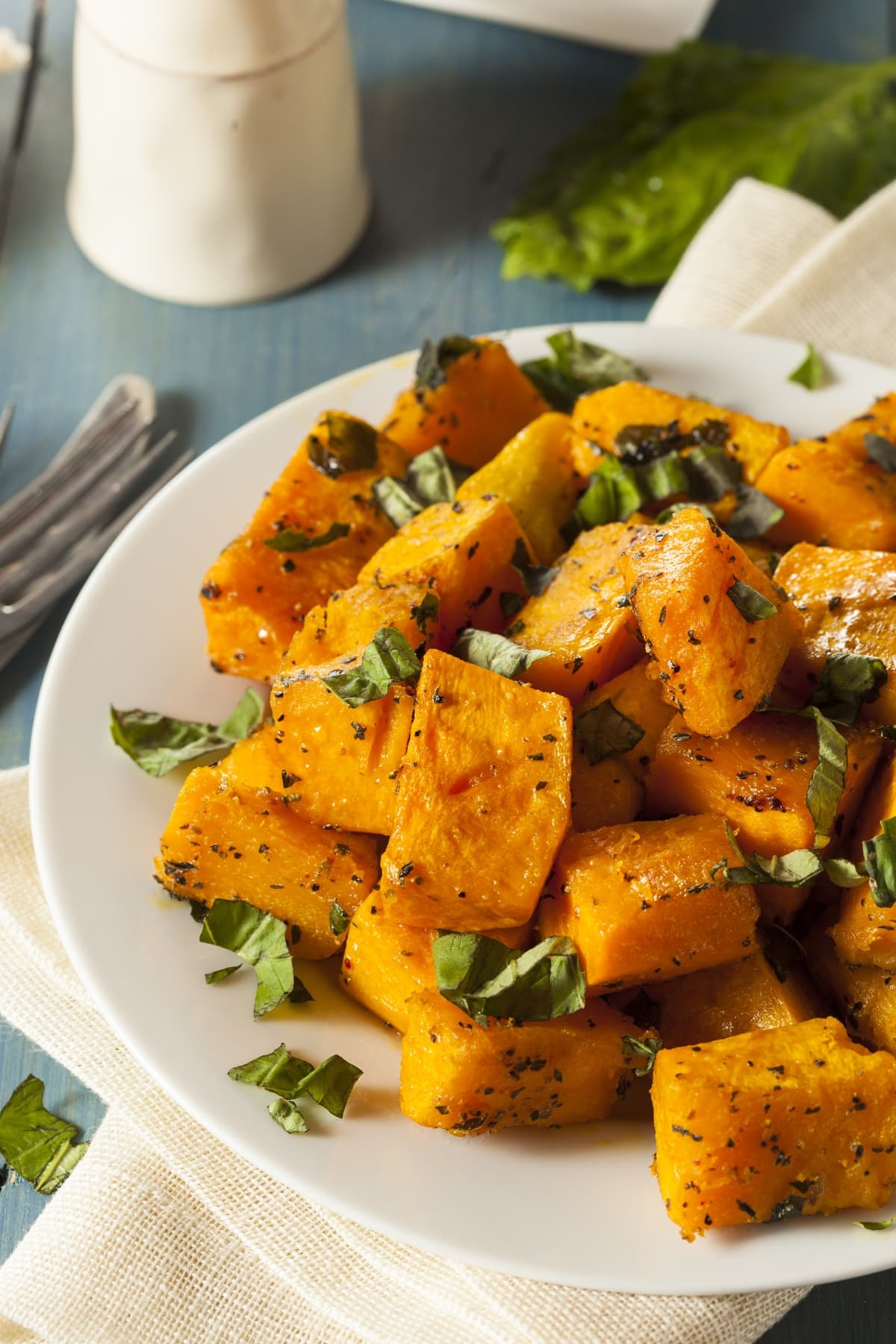 A plate of homemade roasted butternut squash with herbs