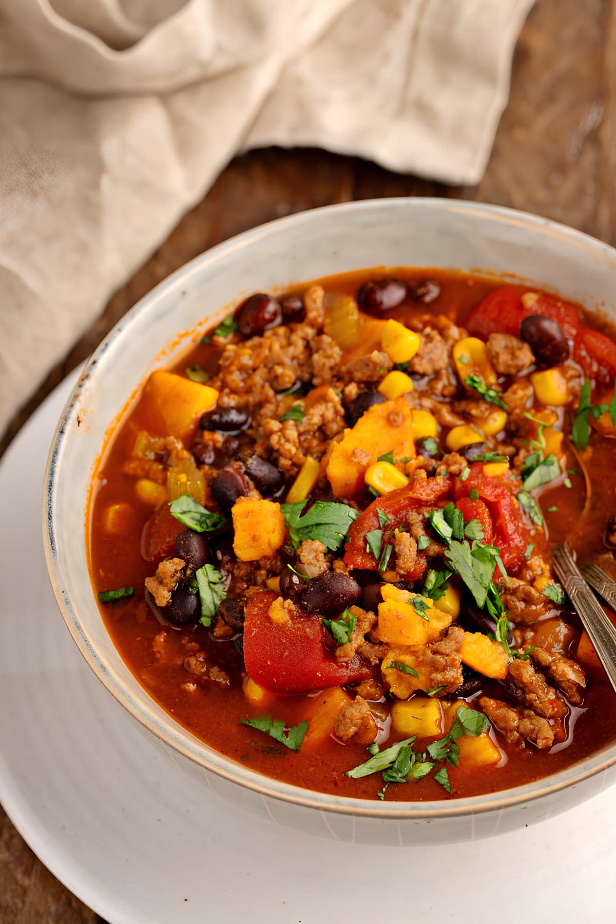 Homemade Sweet Potato Chili with Ground Beef, Beans and Corn in a Bowl