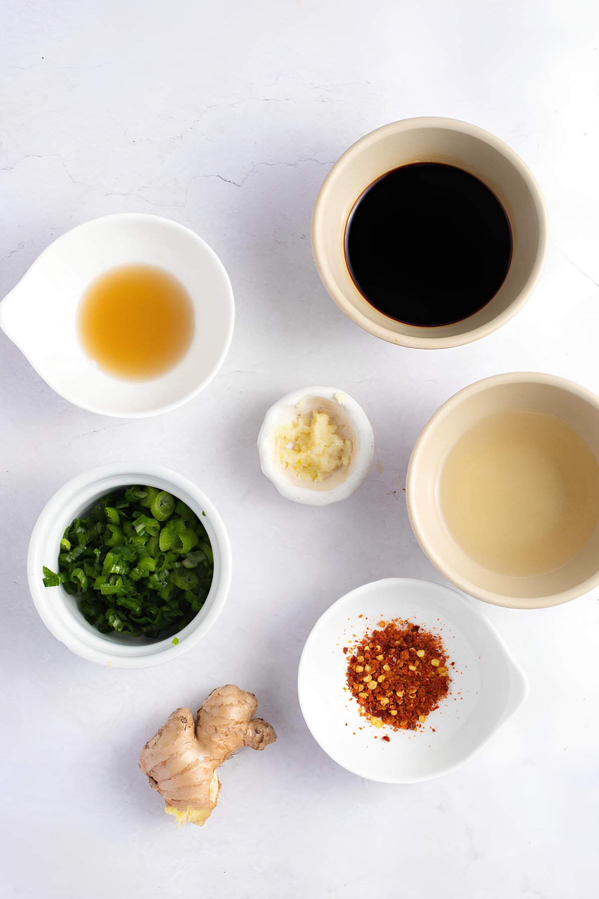 Gyoza Sauce Ingredients: Soy Sauce, Rice Vinegar, Green Onions, Fresh Garlic, Sesami Oil, Red Pepper Flakes and Fresh Ginger
