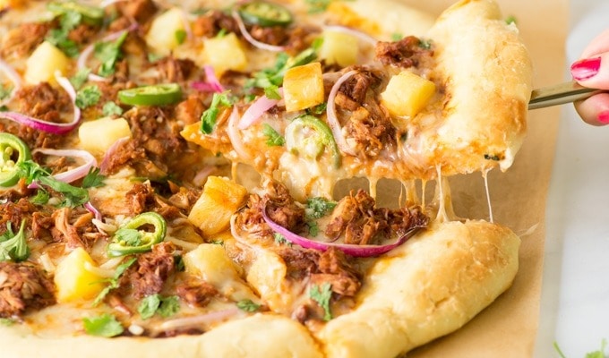 Pizza topped with jackfruit meat and cheese.