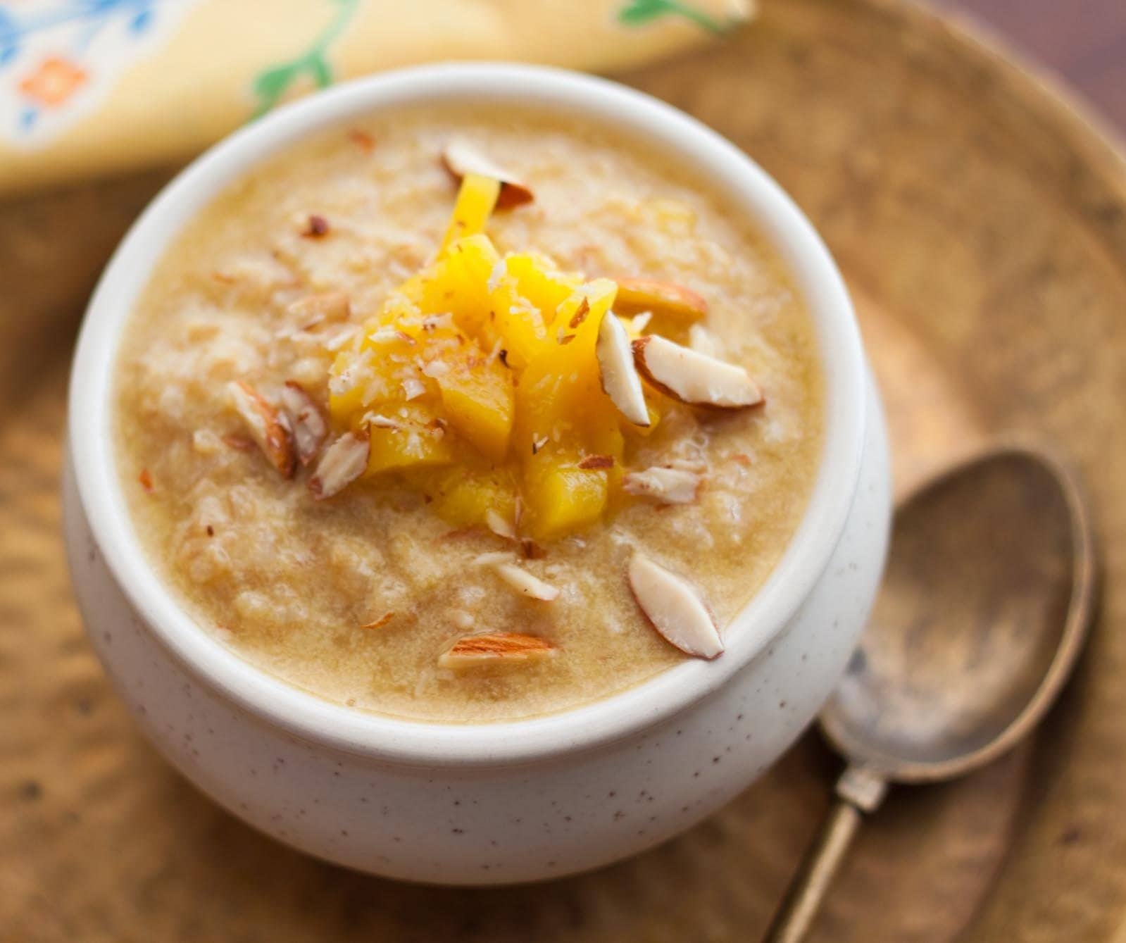 Rice pudding topped with jackfruit and nuts.
