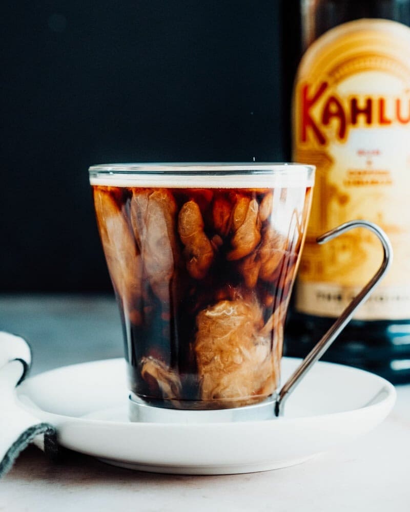 A serving of creamy Kahlua coffee on a glass mug. 