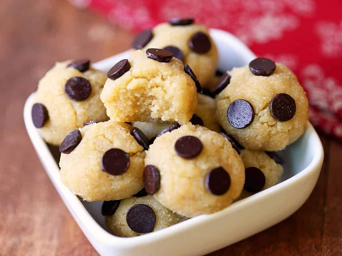 Cookie dough balls with chocolate chips on a bowl.
