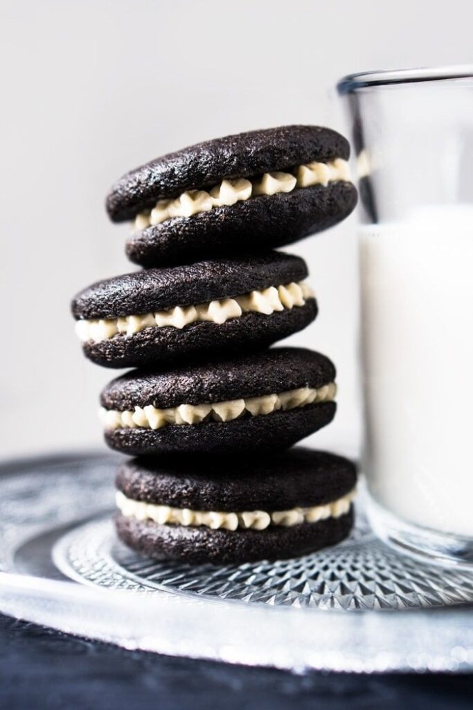 Stack homemade Oreo cookies with cream filling. 
