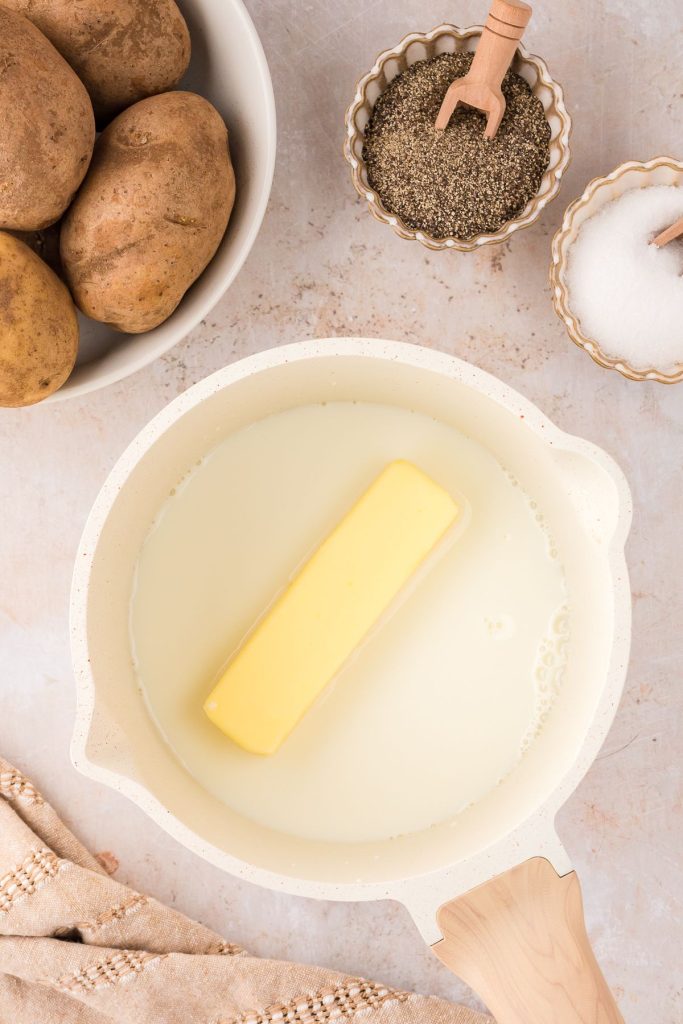 Butter and milk in a pot.