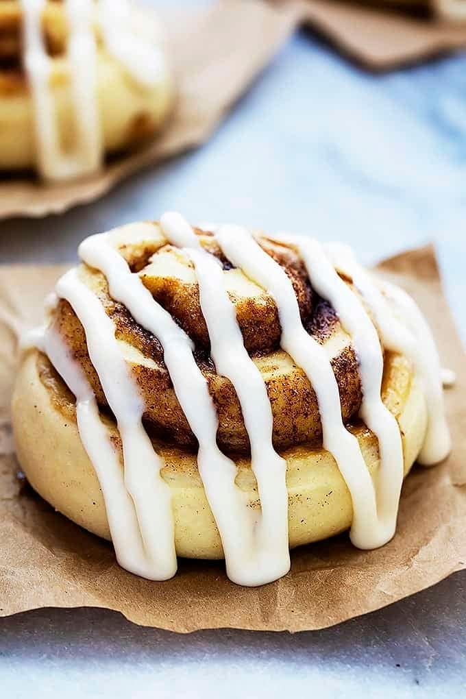 Cinnamon rolls topped with brown sugar and sugar glaze. 