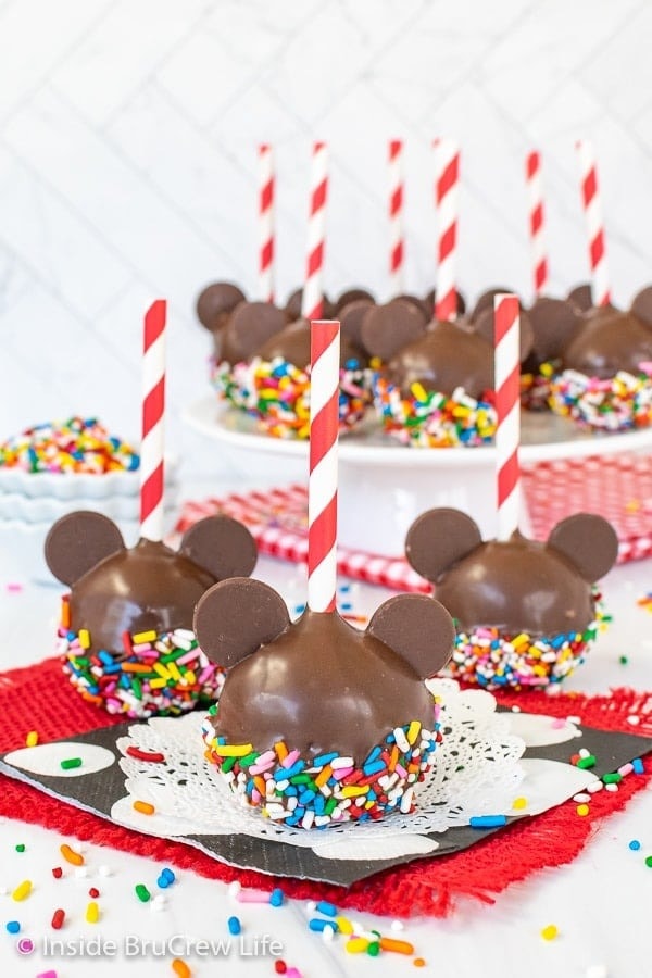 Mickey mouse inspired chocolate coated cake pops dipped in sprinkled. 