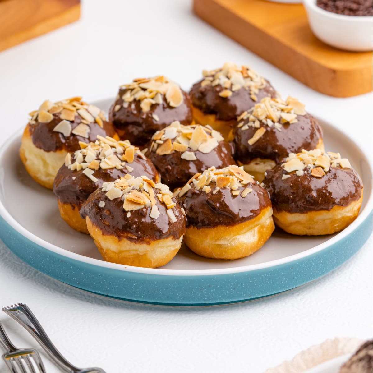 Delicious donuts with chocolate frosting and nuts