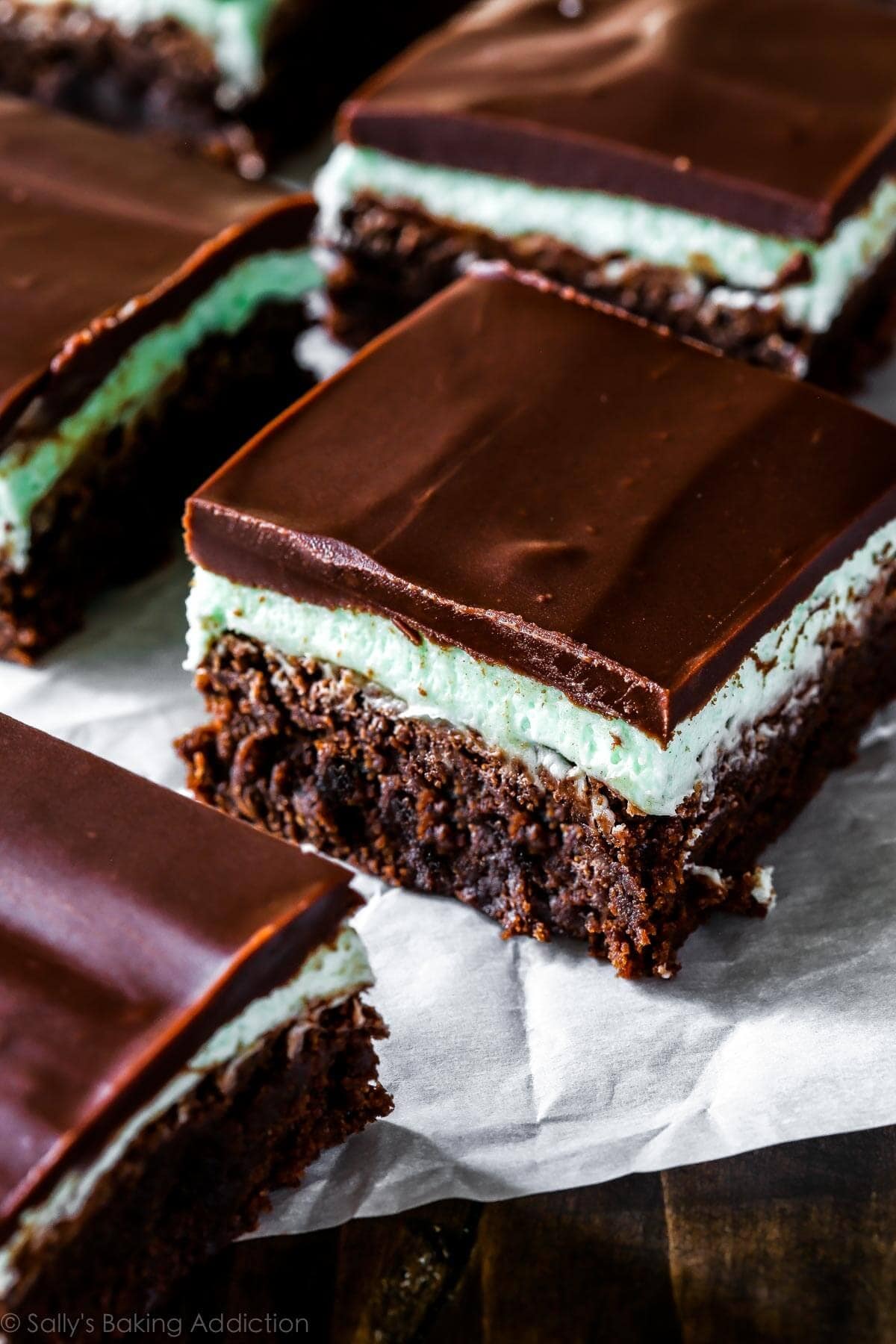 Slices of chocolate brownies with mint filling. 