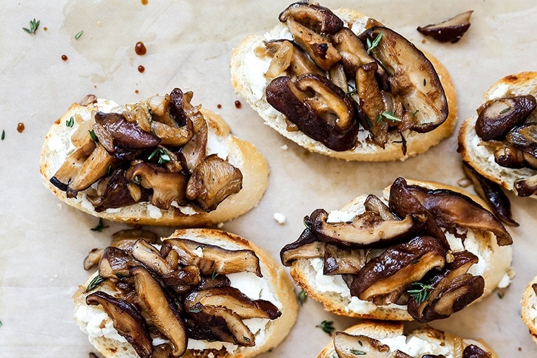Crostini topped with mushroom and goat cheese spread.
