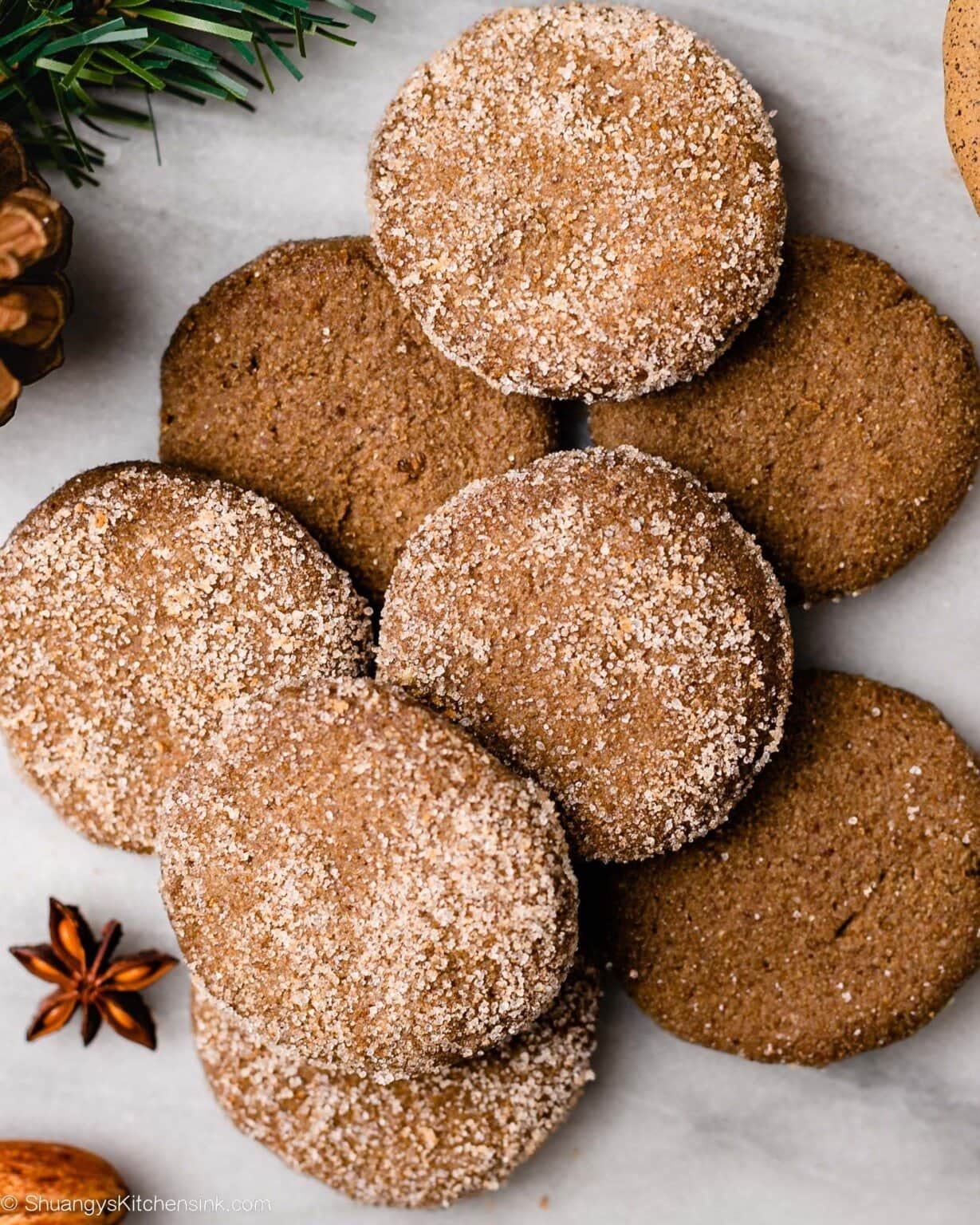 Bunch of sugar coated round gingerbread cookies.