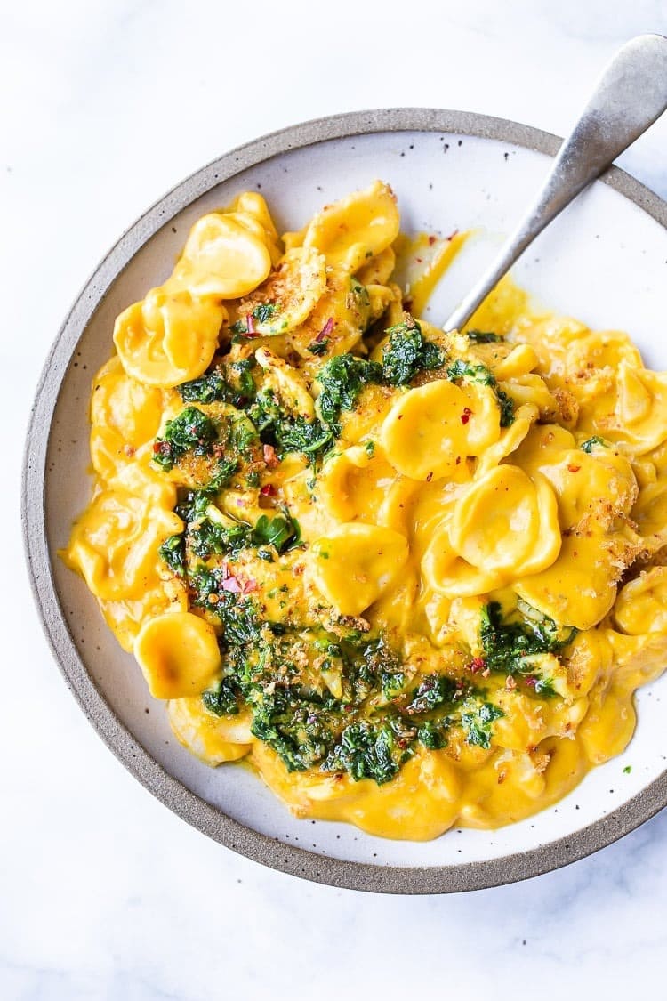 Orecchiette with creamy carrot miso sauce and sautéed parsley.