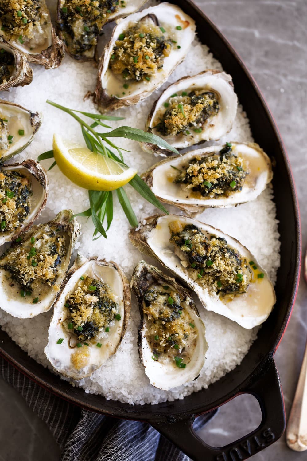 Baked oyster with breadcrumbs and herbs on top. 