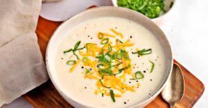 A serving of creamy potato soup in a bowl.