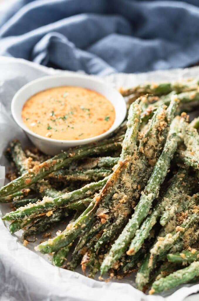 Green beans coated with parmesan cheese served with dipping sauce. 