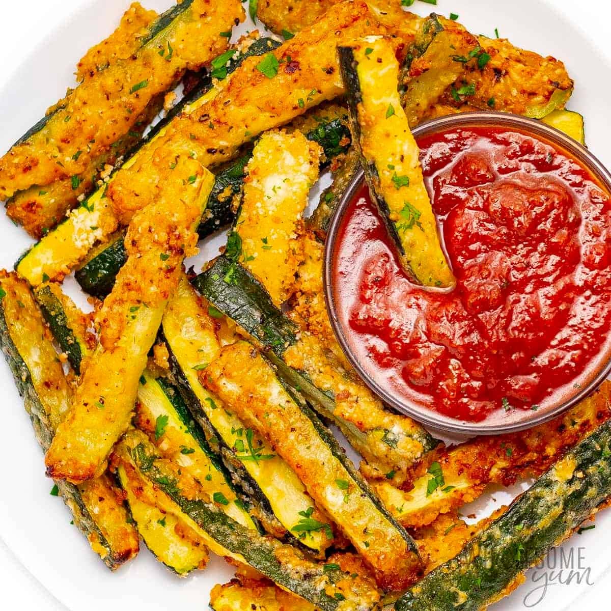 Zucchini sticks covered with parmesan cheese served with dip. 