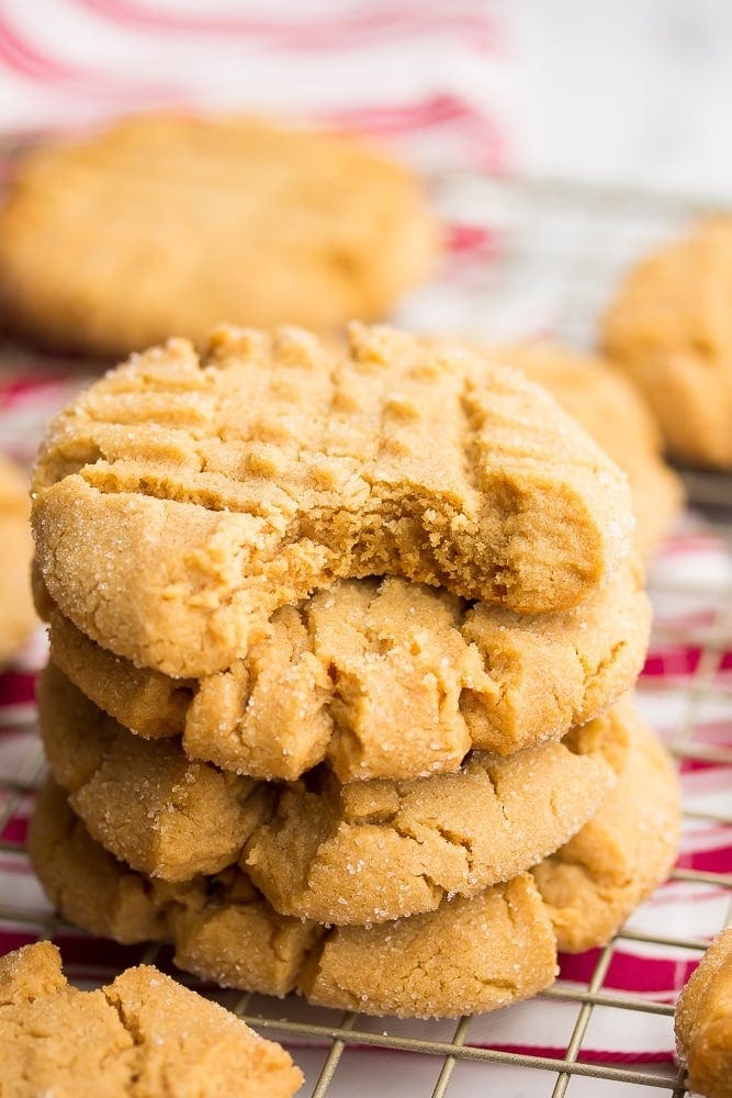 Stack of peanut butter cookies on a cooling rack. 