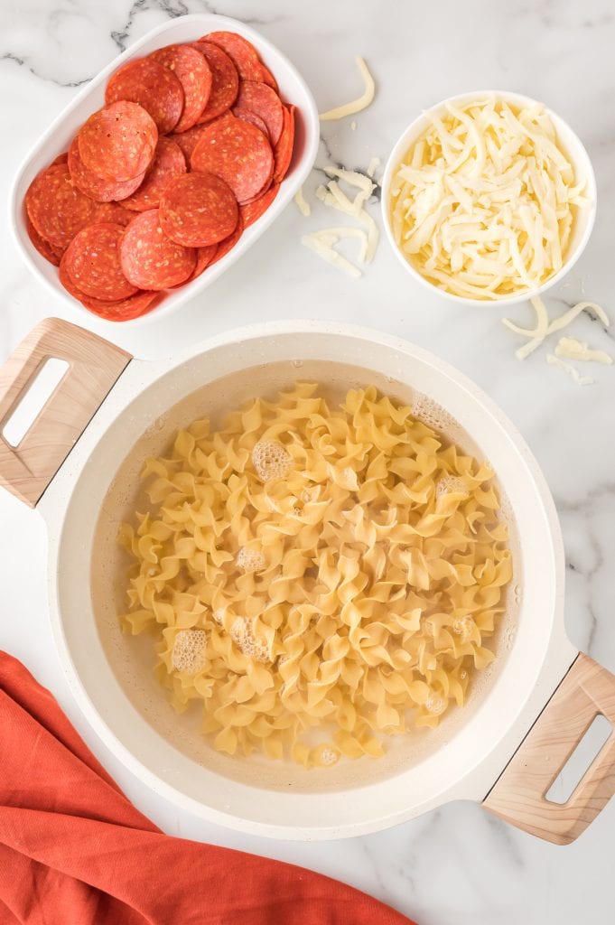Egg noodles boiling in a pot