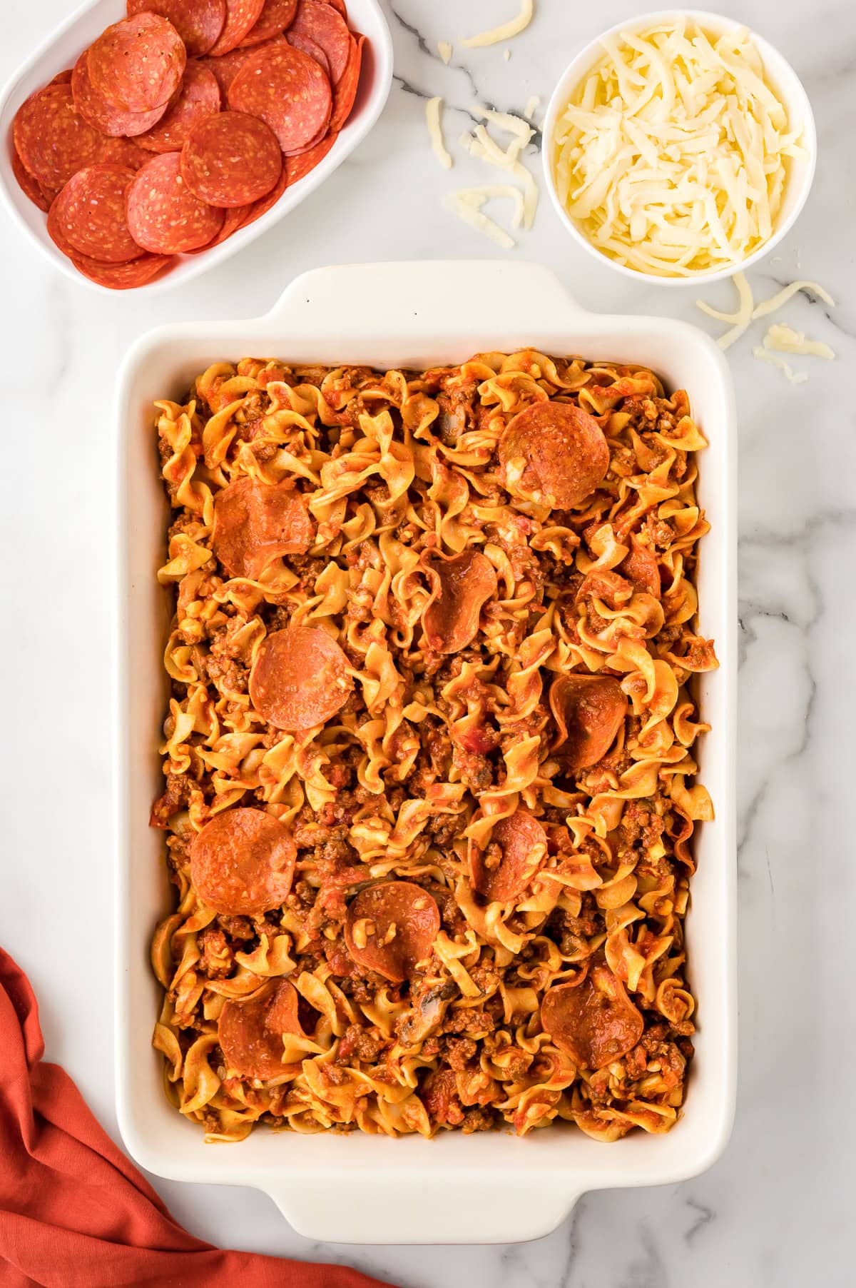 Pre-cooked pepperoni pizza casserole in a baking dish