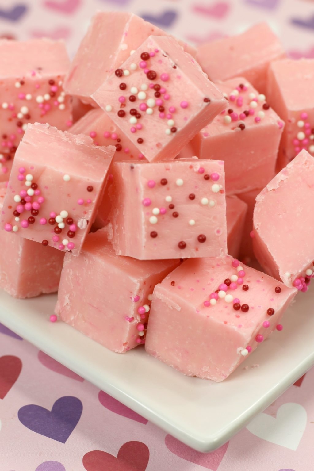 Bunch of pink fudge with sprinkles 