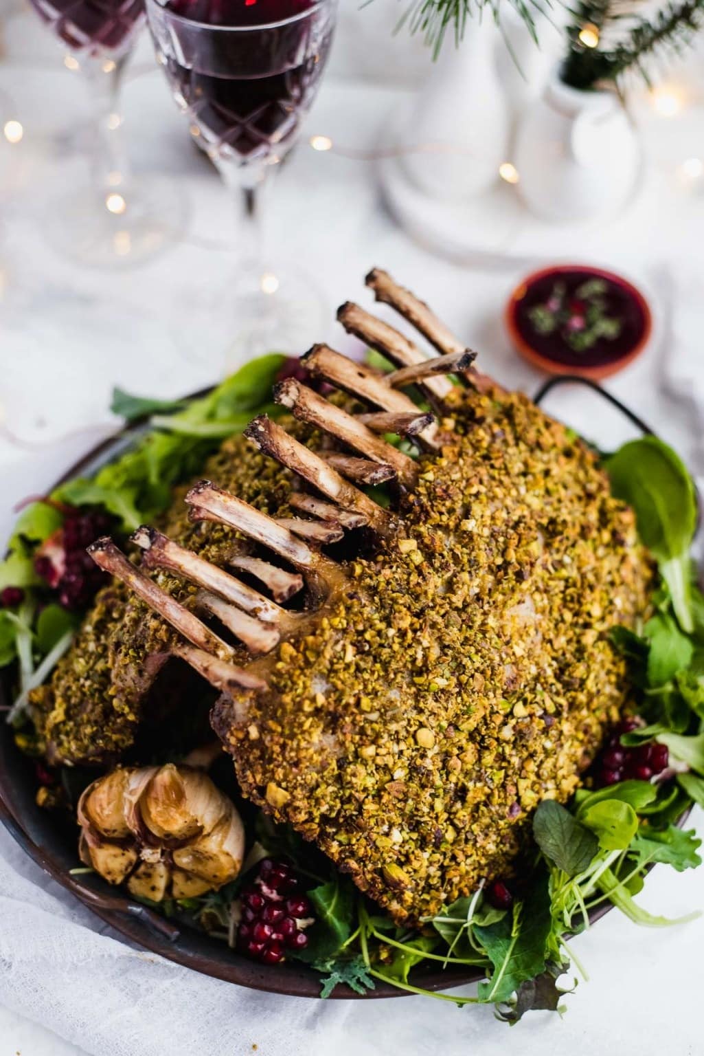 Lamb crusted with pistachio and pesto served on top of arugula salad. 