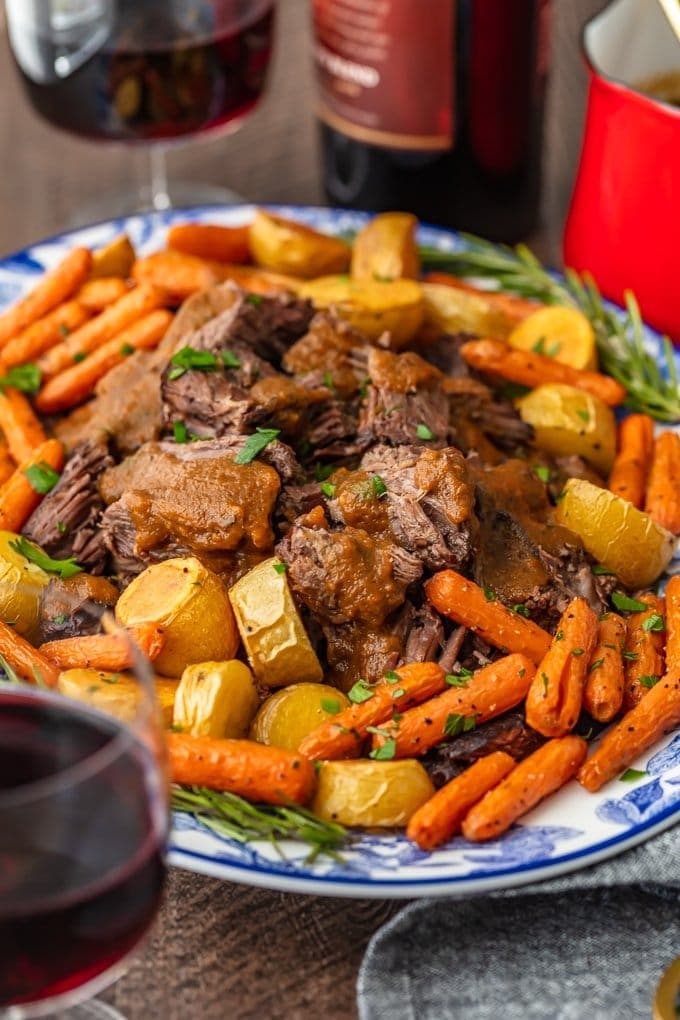 Pot roast served with carrots and potatoes. 