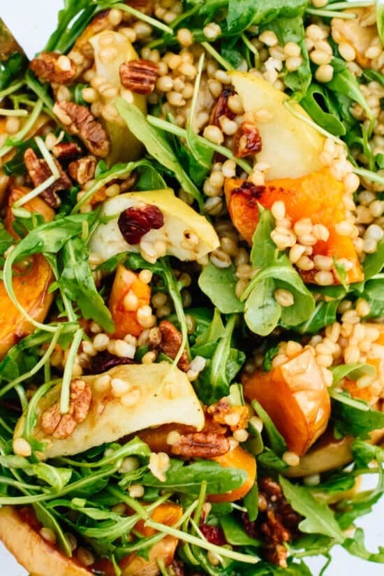 Roasted butternut squash & apple salad with arugula and nuts.
