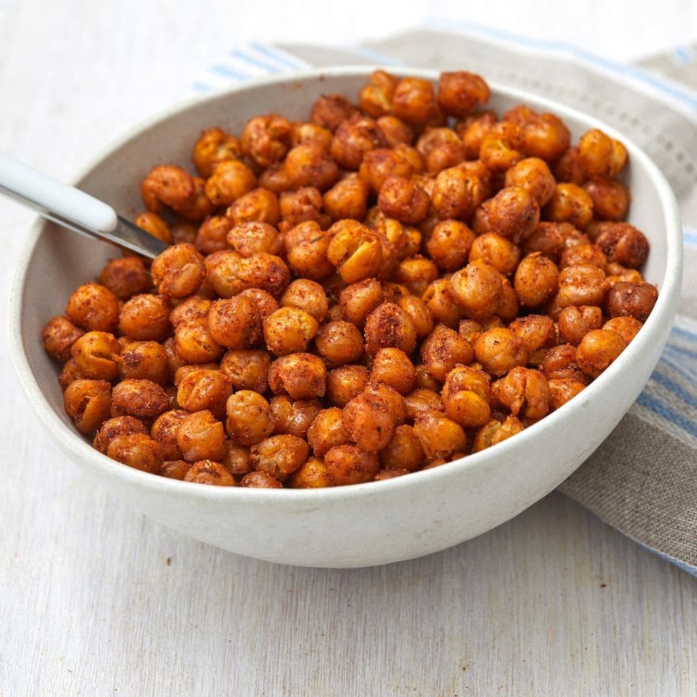 Spoon scooping on a bowl of Roasted Chickpeas 