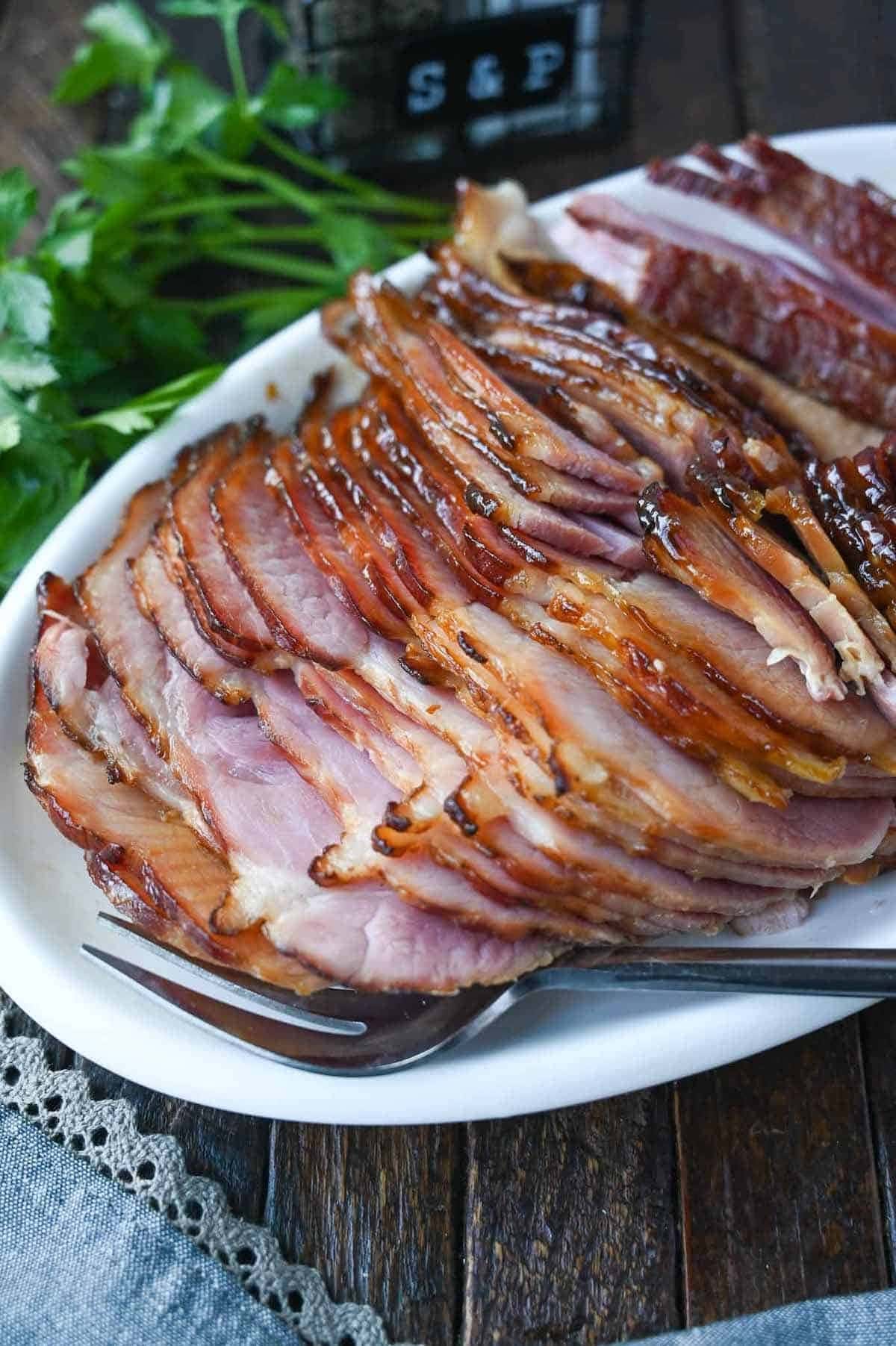 Sliced ham on a serving dish.