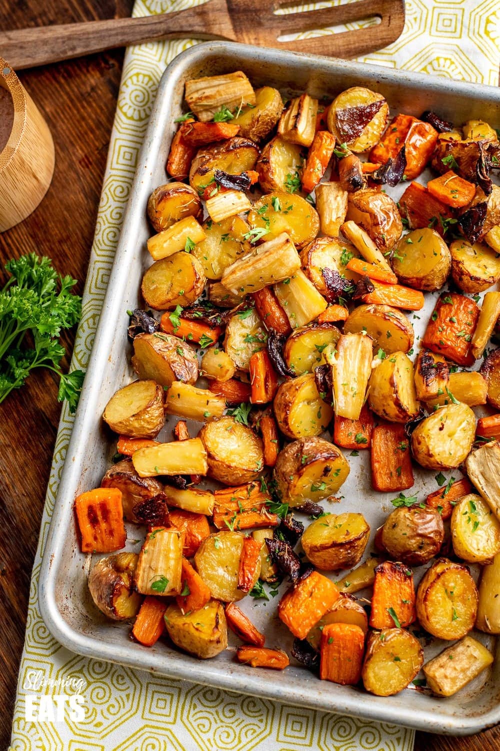 Potatoes, carrots, parsnip and onion roasted on as sheet pan. 