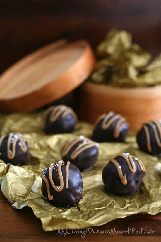 Chocolate covered cake pops drizzled with caramel syrup. 