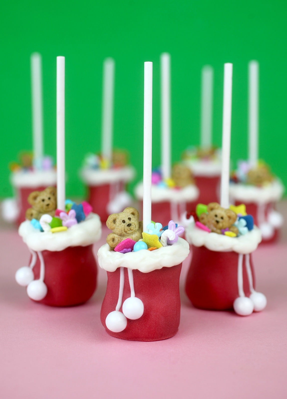 Santa bags inspired cake pops with teddy bear candies and sprinkles inside. 