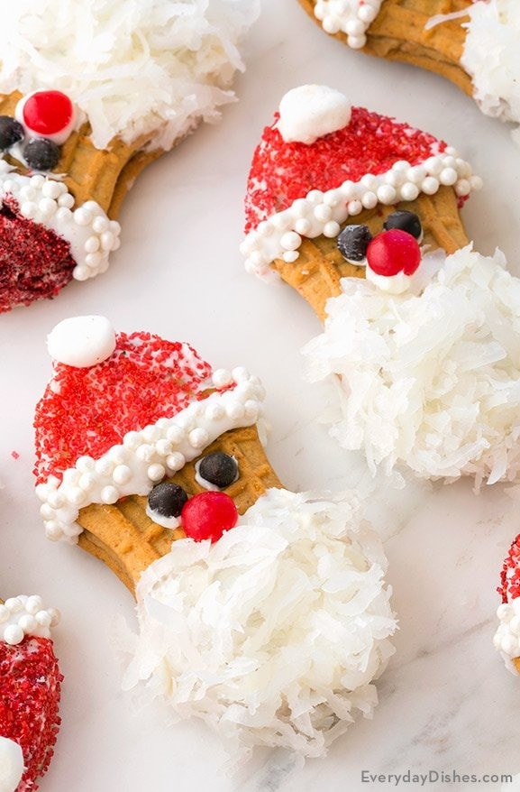 Santa inspired nutter butter cookies decorated with icing and shredded coconut. 