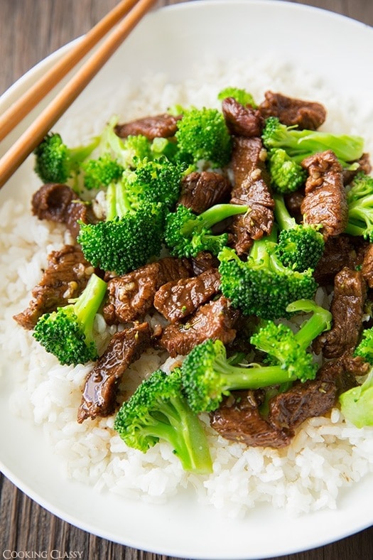 Slow Cooker Beef and Broccoli served on a plate with white rice 