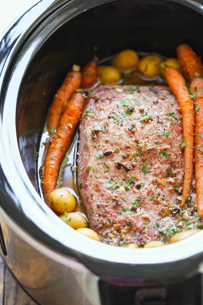 Slow Cooker Corned Beef with carrots, potatoes, parsley and seasoning