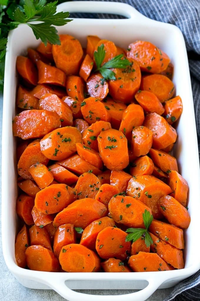 Sliced glazed carrots on a casserole dish.