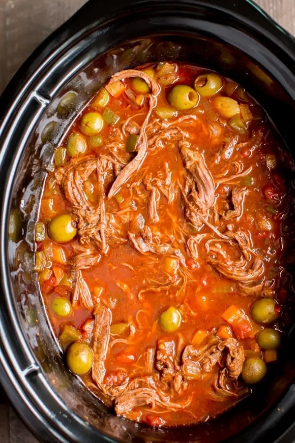 Slow Cooker Ropa Vieja  with diced tomatoes, bell peppers and Spanish olives