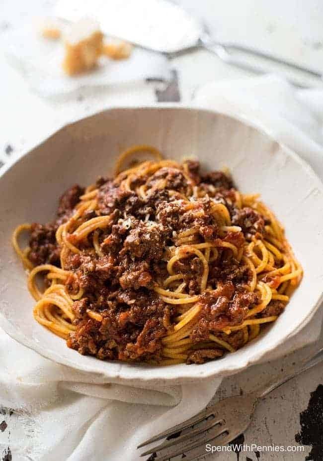 Spaghetti pasta with Bolognese sauce garnished with parmesan cheese