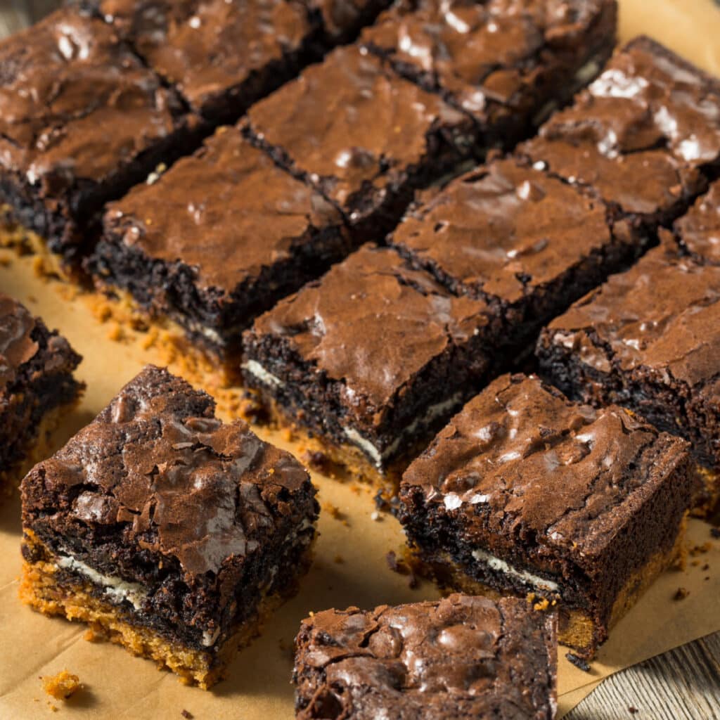 Brownie bars arranged on a parchment paper. 