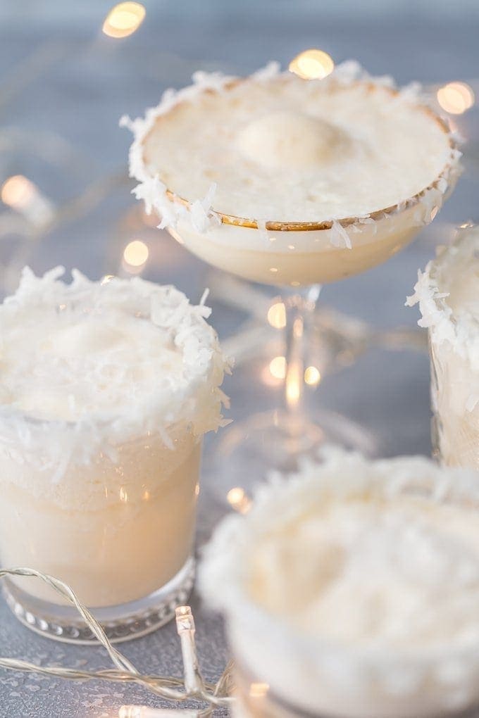 Coconut punch on rimmed margarita glasses.