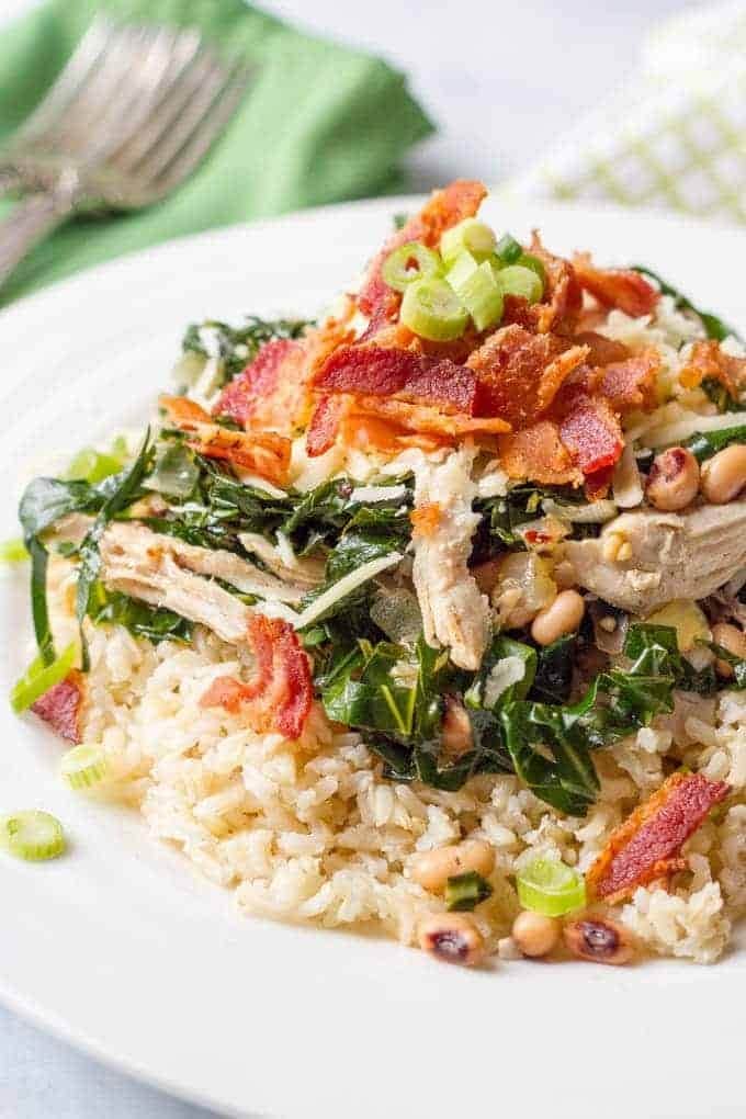 Brown rice topped with veggies, shredded chicken and fried bacon. 