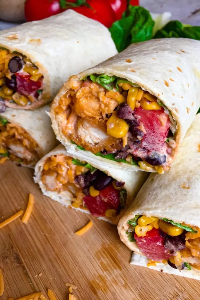 Creamy homemade southwest chicken wrap with corn, tomatoes and beans