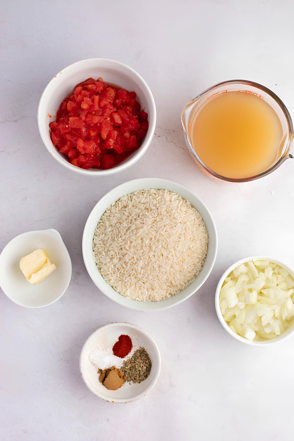 Spanish Rice Ingredients: Butter, Onion, Garlic, Long Grain Rice, Diced Tomatoes, Chicken Broth and Seasonings