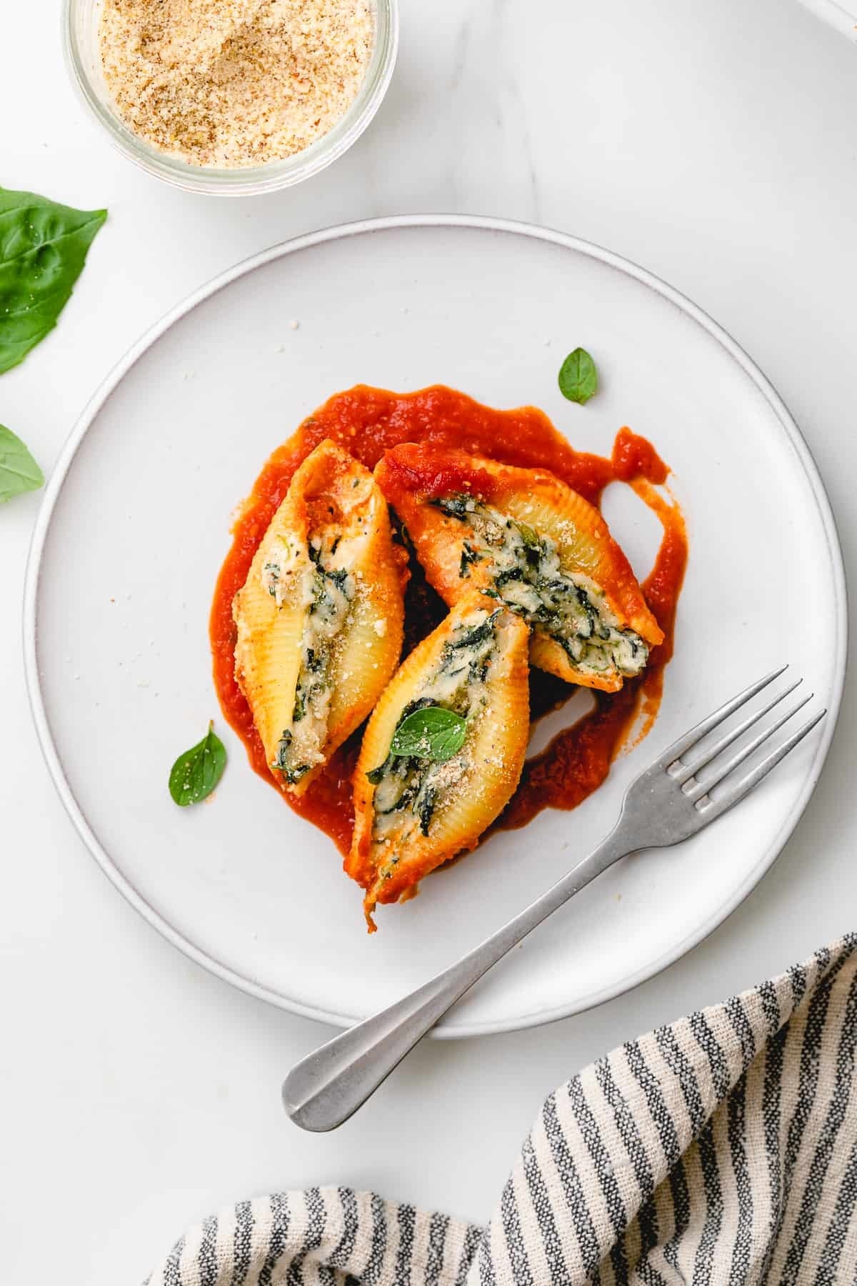 Pasta shells stuffed with spinach and cheese.