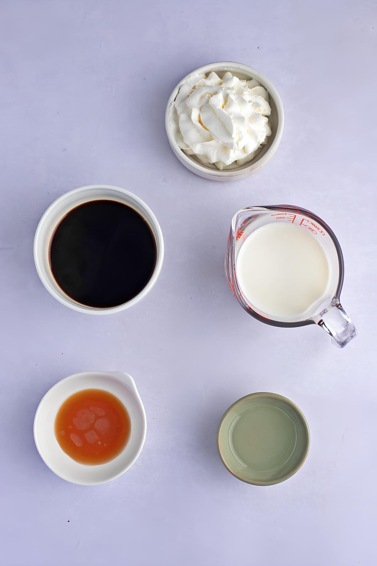 Starbucks Caramel Macchiato ingredients: espresso, milk, caramel syrup and whipped cream. 