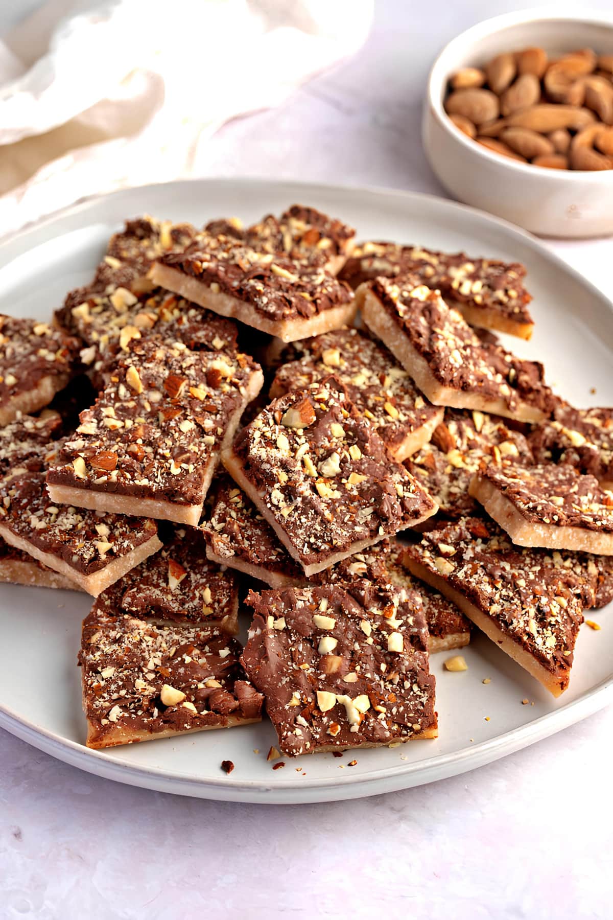 Homemade Almond Roca Bars Stacked on a Plate