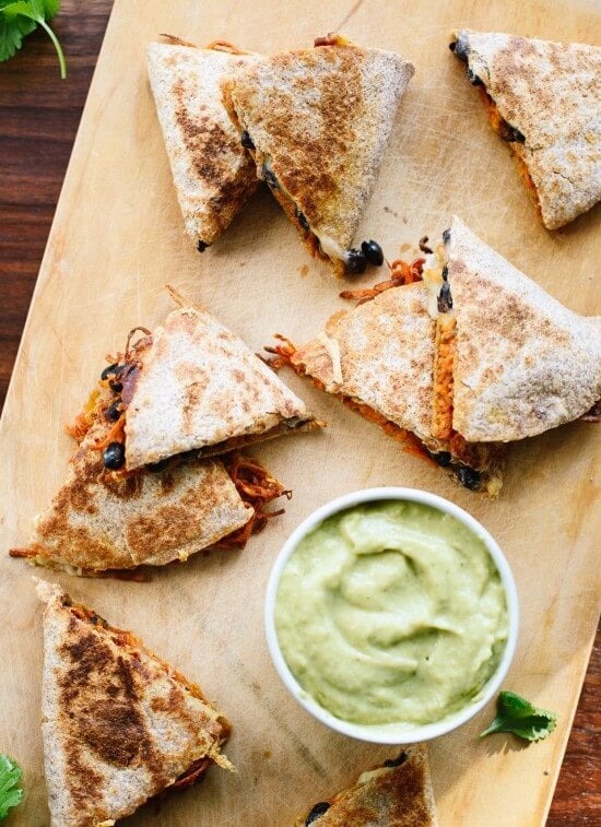 Quesadillas filled with sweet potato and black beans served with avocado salsa verde. 