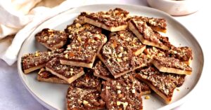 Chocolate Almond Roca Bark Stacked in a Plate