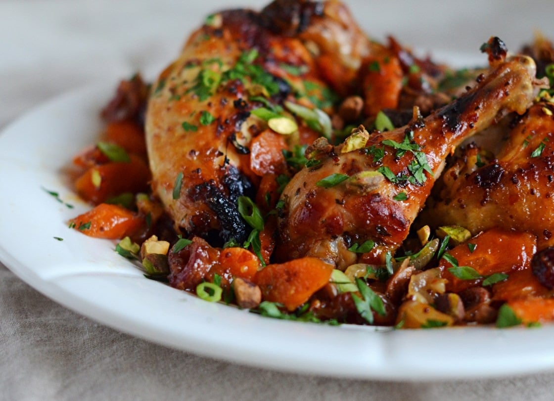 Roast chicken with carrots, dates & pistachios on a plate. 